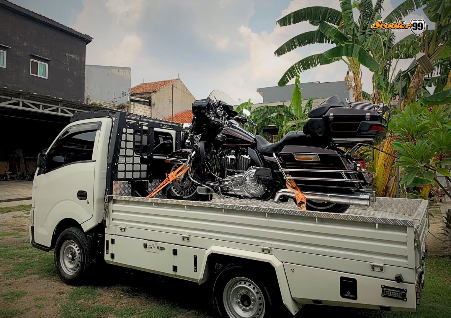 Towing truck in action, securing a vehicle on the roadside
